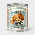 An Unhinged Paintcan candle with a picture of a vintage Puppy with the phrase "Adulting makes my tummy hurt".
