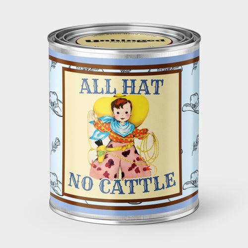 An Unhinged Paintcan candle with a picture of a vintage cowboy with the phrase "All Hat No Cattle".