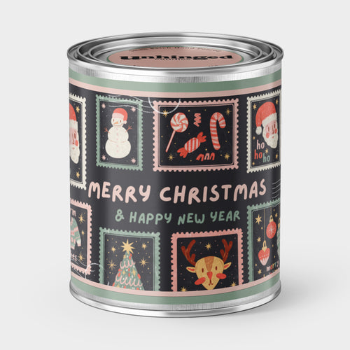 Decorative Christmas postage stamp soy wax candle with the phrase Merry Christmas & Happy New Year 