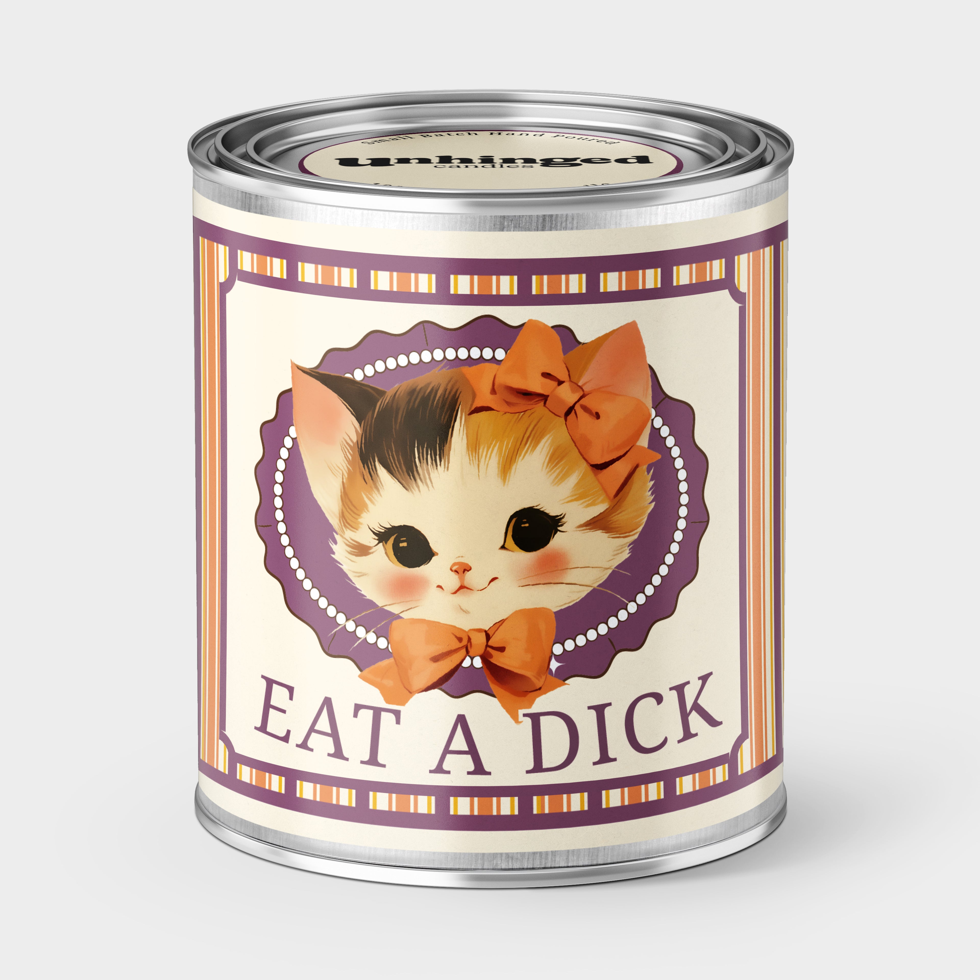 An Unhinged Paintcan candle with a picture of a cute kitten with a bow with the phrase "eat a dick" on a striped background