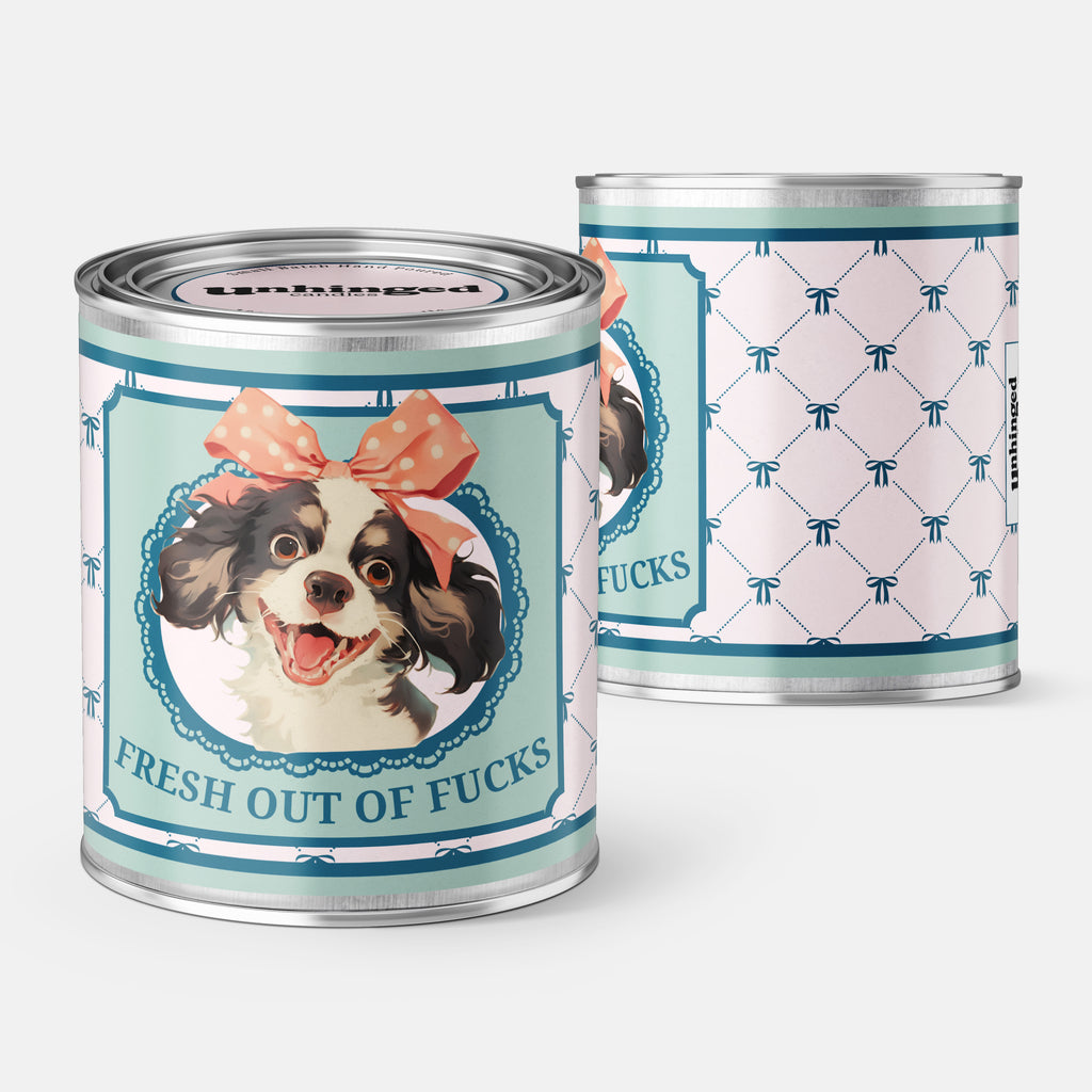 front and back pic of An Unhinged Paintcan candle with a picture of a cute puppy with a bow with the phrase "Fresh out of fucks" 