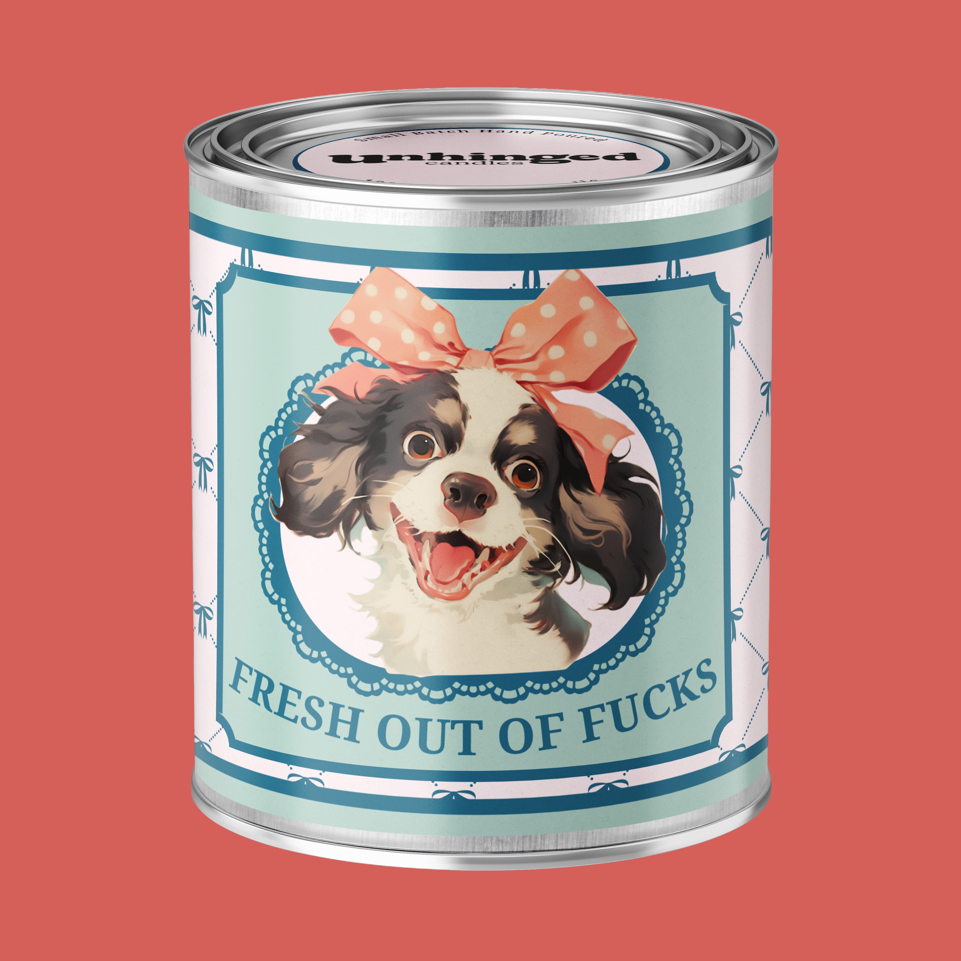 An Unhinged Paintcan candle with a picture of a cute puppy with a bow with the phrase "Fresh out of fucks" 