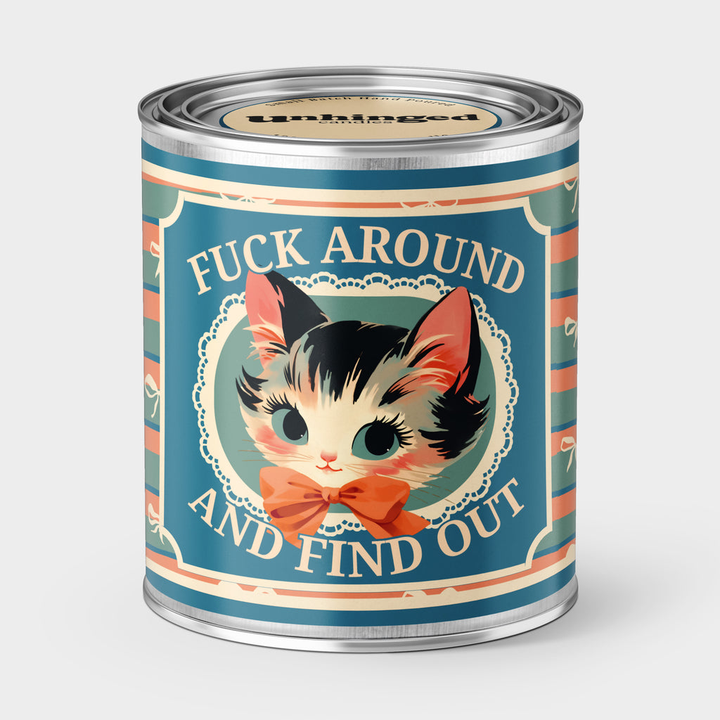 An Unhinged Paintcan candle with a picture of a cute kitten with the phrase "Fuck around and find out" on a striped background.