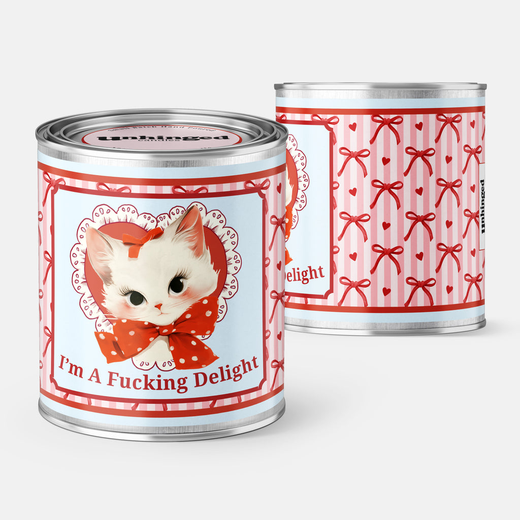 front and back pic of An Unhinged Paintcan candle with a vintage sweet kitten drawing and the phrase "Im a fucking delight" with red and pink striped background. 