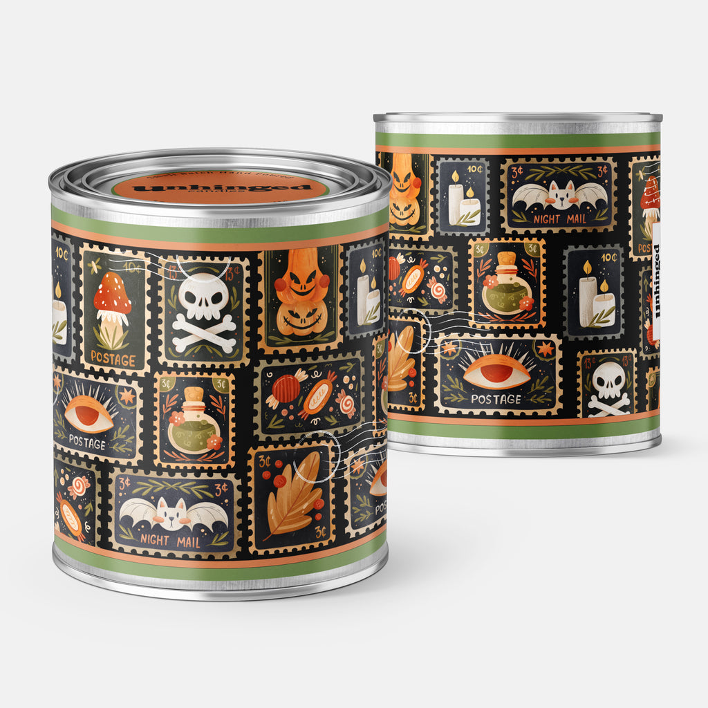 front and back pick of a Paint can candle with Halloween postage stamps themed label