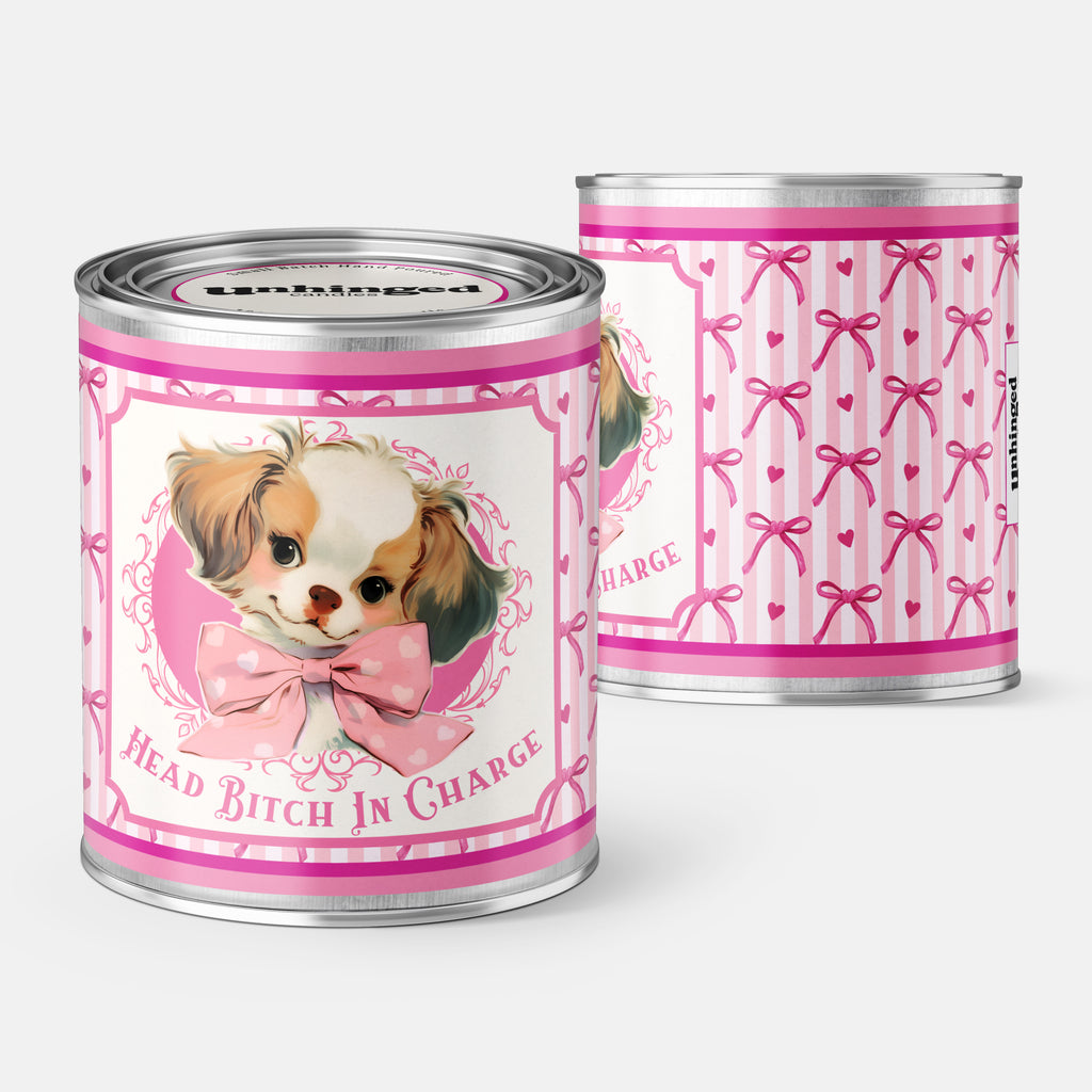 An Unhinged Candle Paintcan vessel with a label stating "Head bitch in charge" with a vintage illustration of a cute puppy with pink and white striped background.