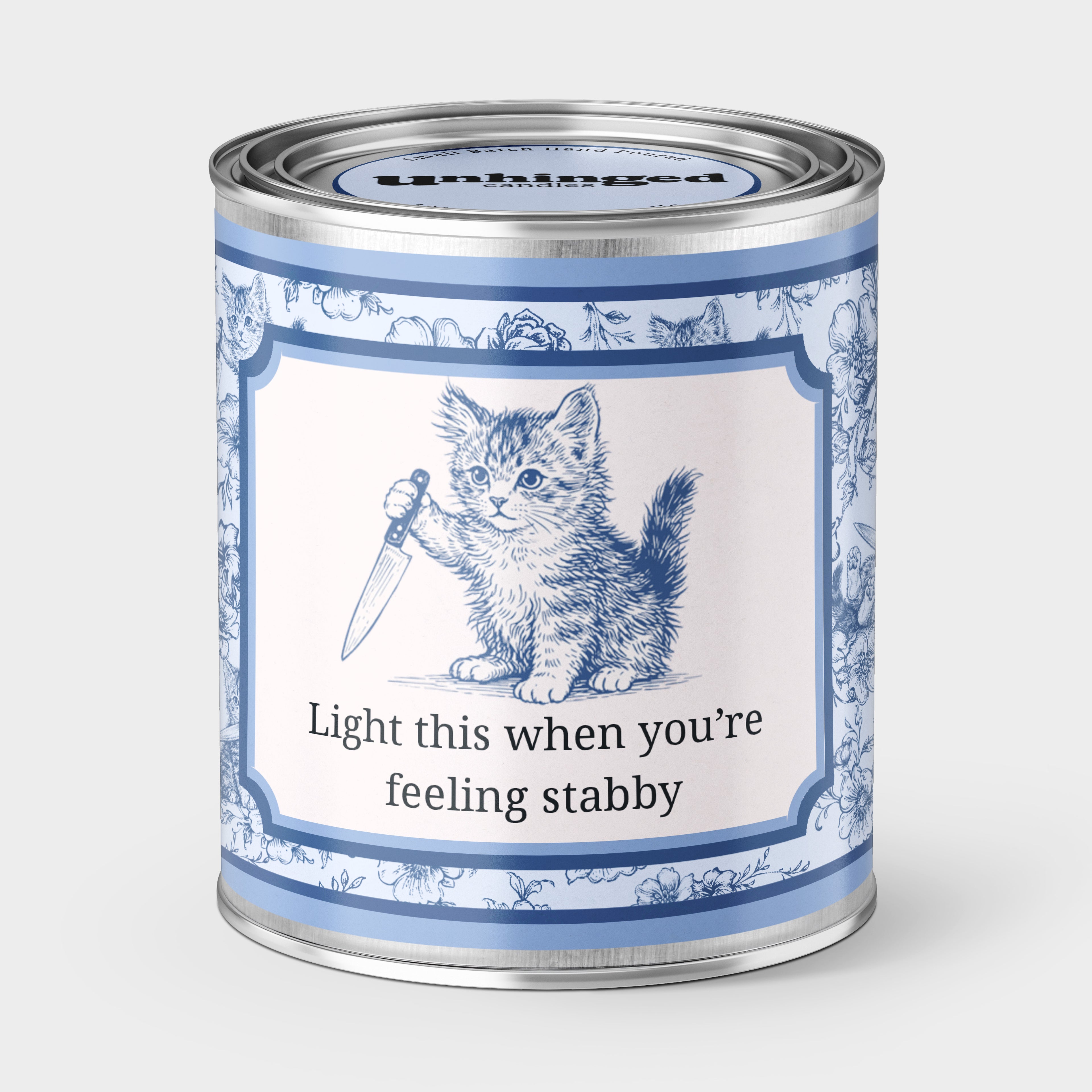 An Unhinged Candle Paintcan pint sized candle of a kitten holding a knife with the instructions "Light this when you're feeling stabby"
