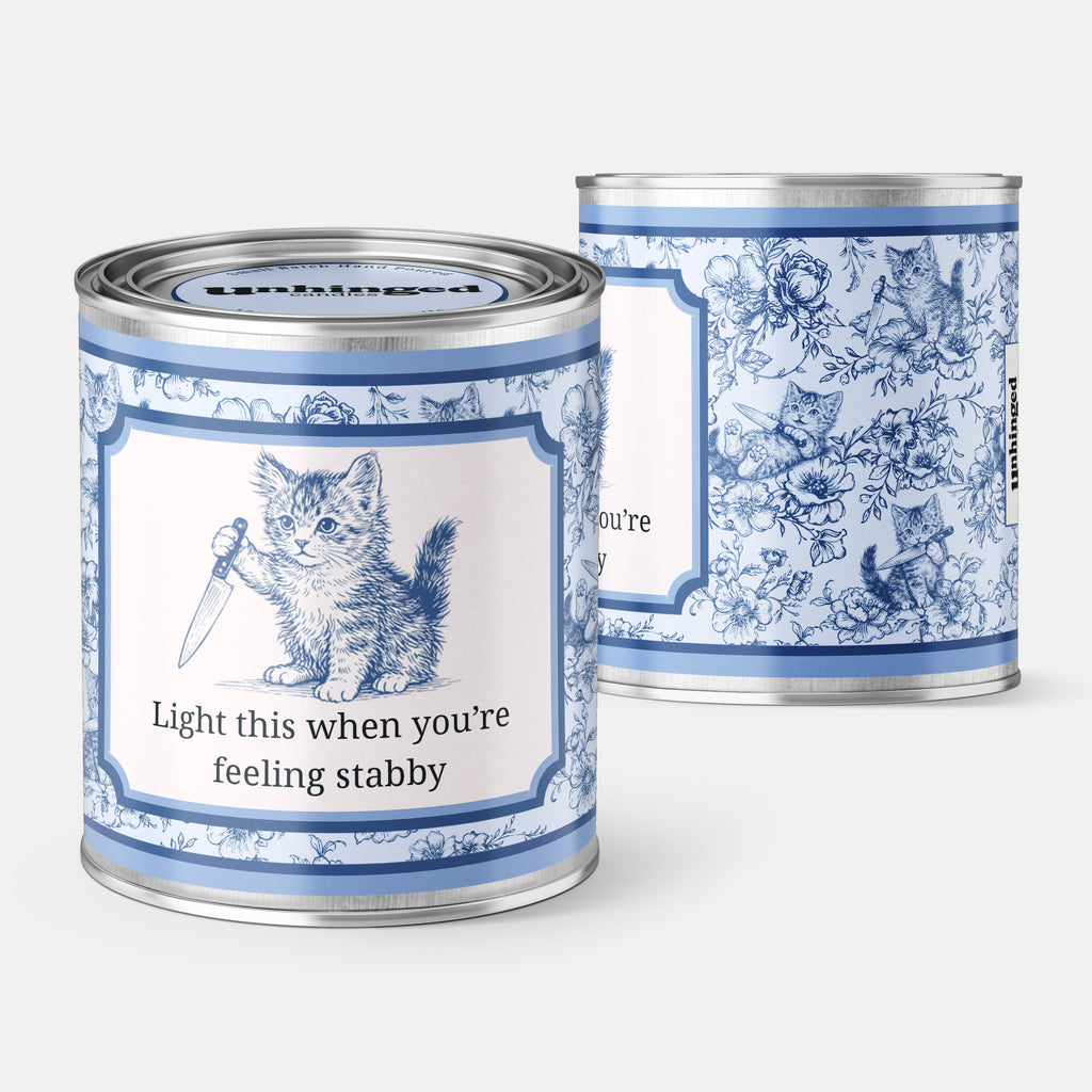 Front and back pic of An Unhinged Candle Paintcan pint sized candle of a kitten holding a knife with the instructions "Light this when you're feeling stabby"